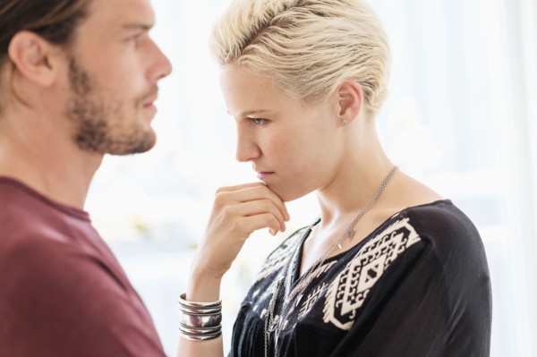 Couple arguing in living room.