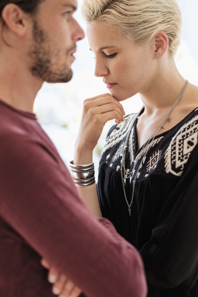 Couple arguing in living room.