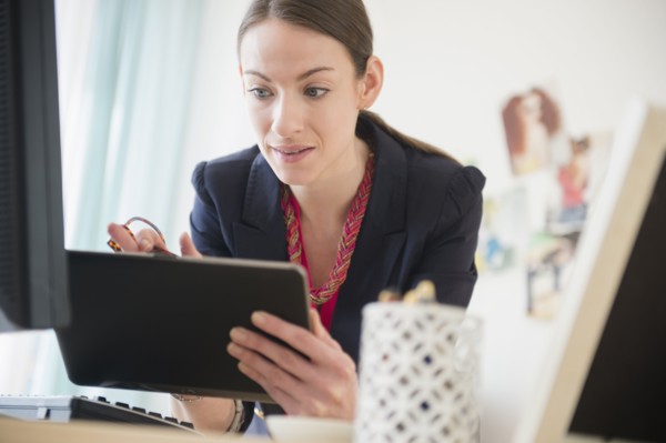 Woman using tablet in office