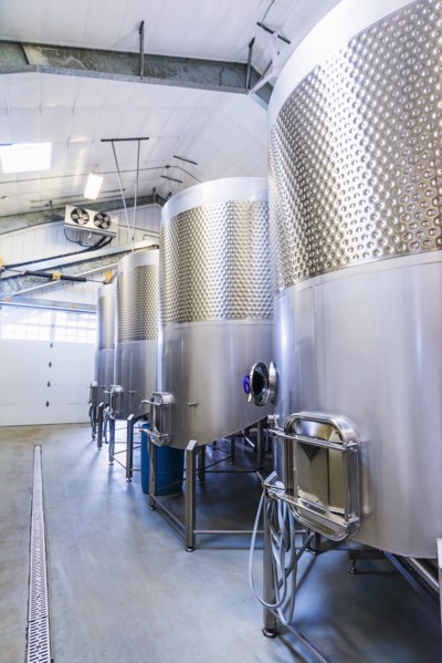 Stainless steel tanks in winery cellar