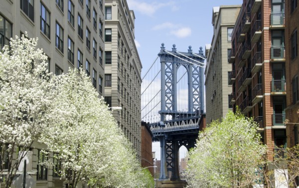 Manhattan Bridge seen between residential buildings