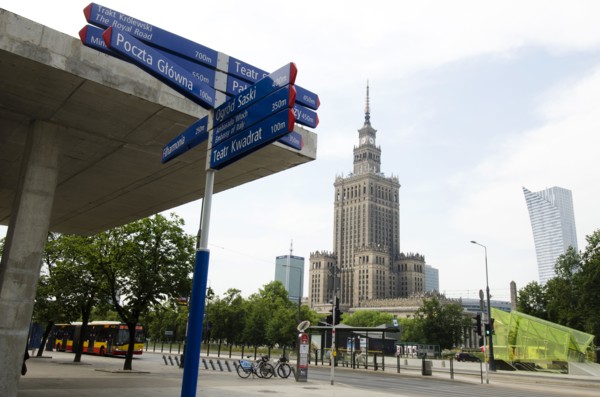 Sign post with Palace of Culture and Science in background