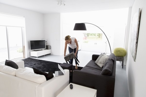 Woman cleaning living room