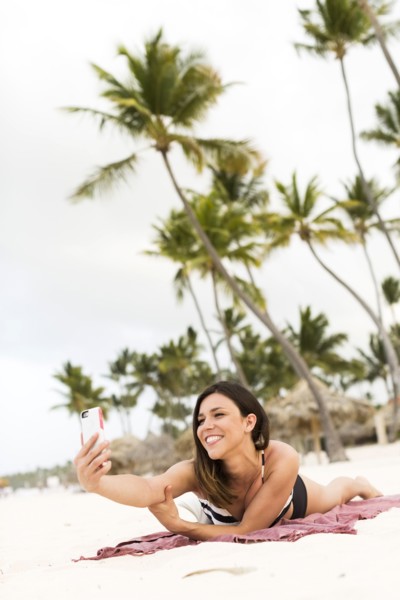 Woman in bikini relaxing on beach