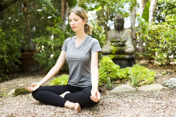 Woman meditating in park