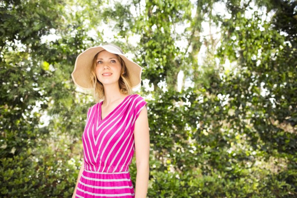 Woman standing by trees