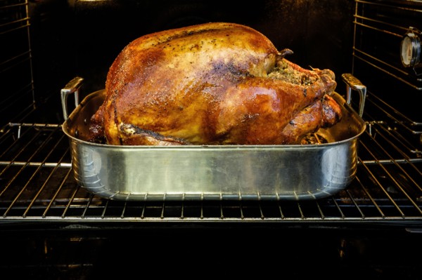 Roasted turkey for Thanksgiving in oven.
