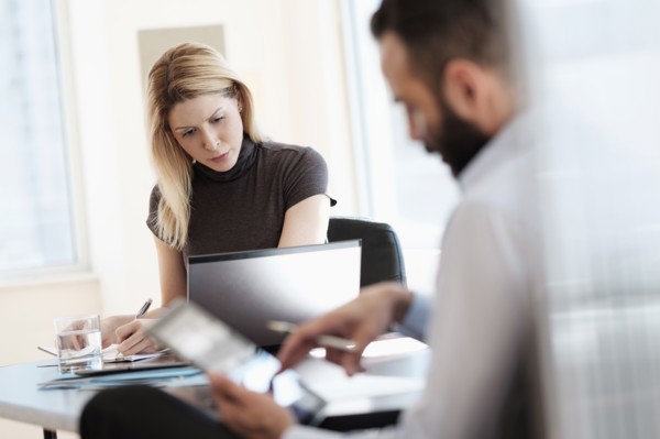Man and woman working in office.