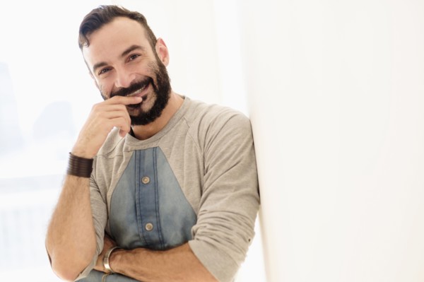 Portrait of bearded man looking at camera.