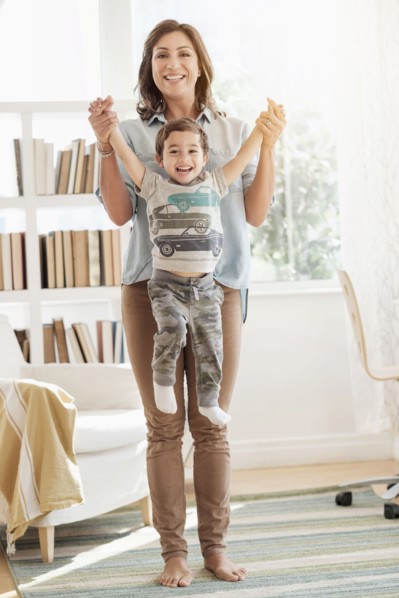 Mother holding son (2-3).