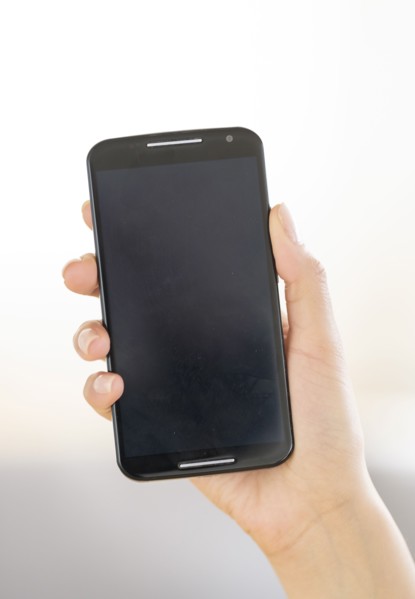 Hand holding smart phone.