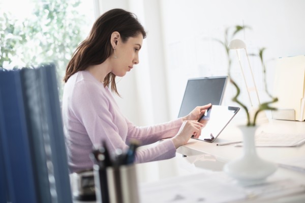 Young woman using digital tablet.