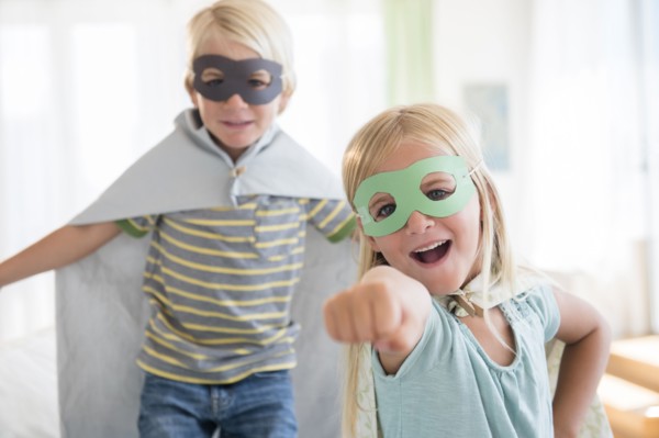 Boy (4-5) and girl (6-7) wearing masks