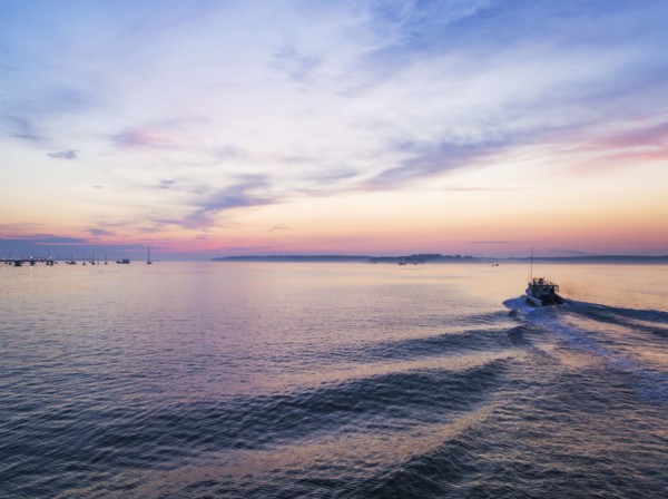 Fishing boat heading towards harbor
