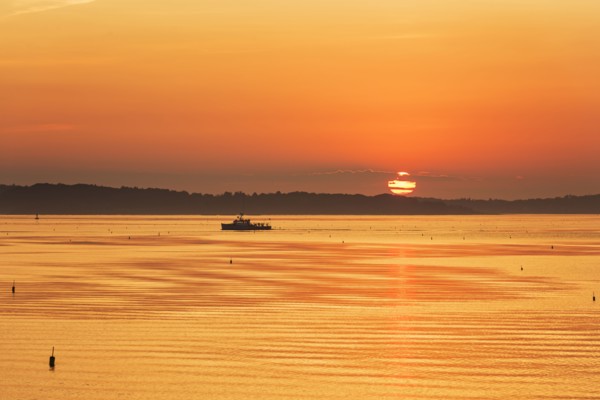 Lobstermen fishing in golden sunrise
