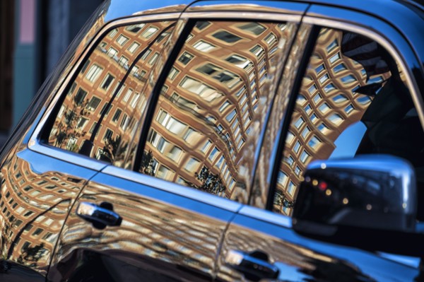 Building reflected in car