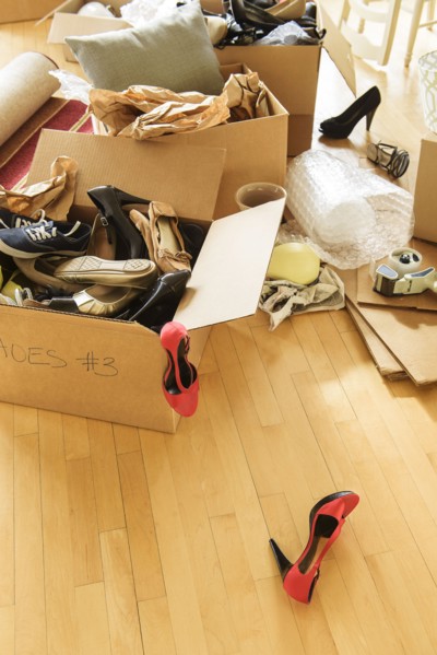 Cardboard boxes on wooden floor.