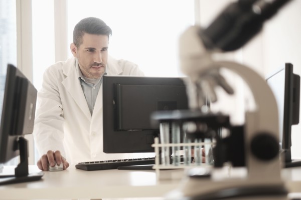 Man using computer in laboratory.