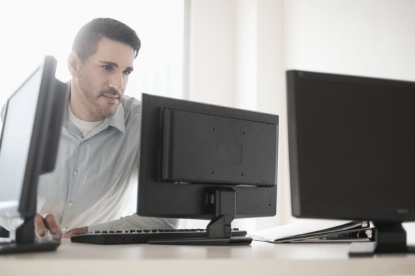 Man using computer in office.