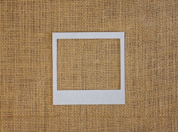 Studio shot of picture frame on fabric