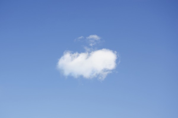 Single cumulus cloud in blue sky