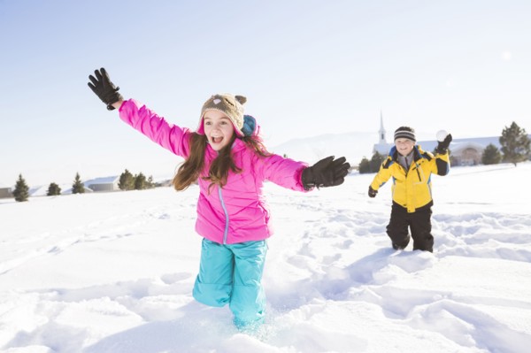 Children (8-9, 10-11) playing in snow