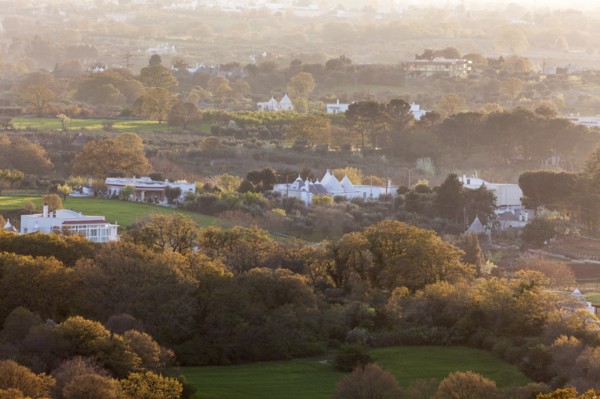 Landscape with trulli houses at sunset