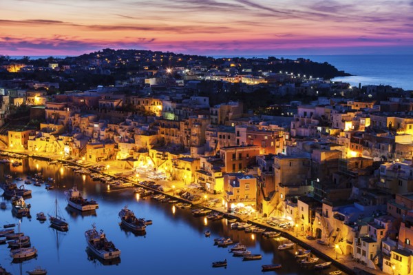 Illuminated townscape on Marina Corricella on Procida Island