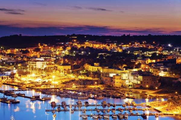 Illuminated townscape of Santa Maria di Leuca with marina in foreground