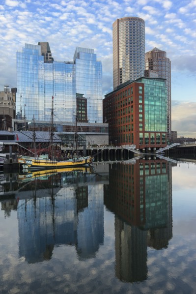 Waterfront buildings reflecting in water