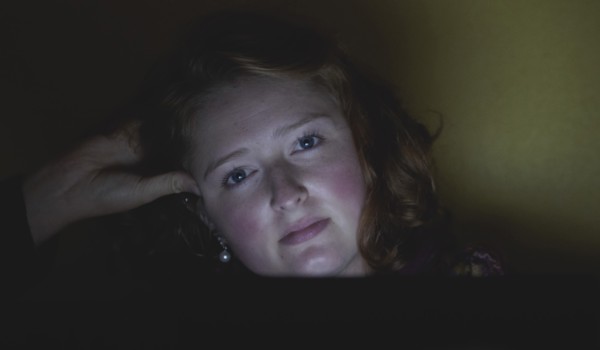 Woman with hand in hair