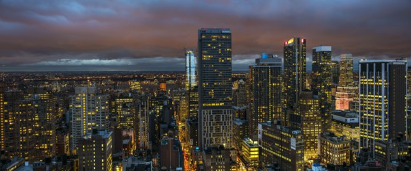 Illuminated cityscape at night. USA, New York, New York City.