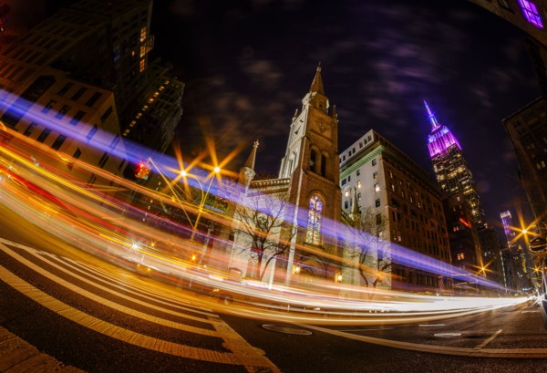 St Bartholomew's Church at night with long exposure of traffic at night. USA, New York, New York City.