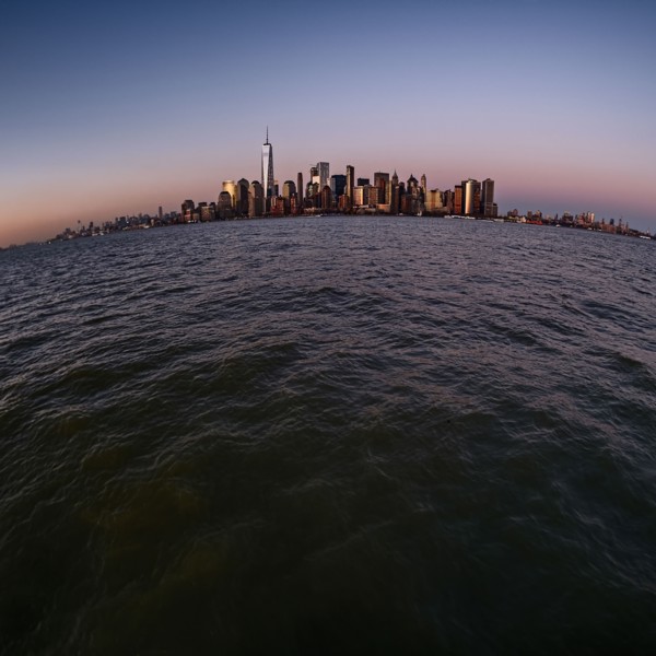 Urban skyline at dusk. USA, New York, New York City.