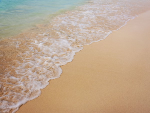 Surf on sandy beach