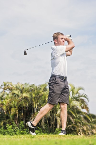 Man swinging golf club
