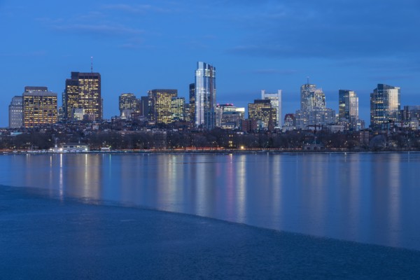 Charles river and illuminated downtown district at dusk
