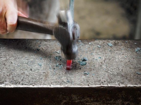 Close up of hand of female blacksmith with hammer