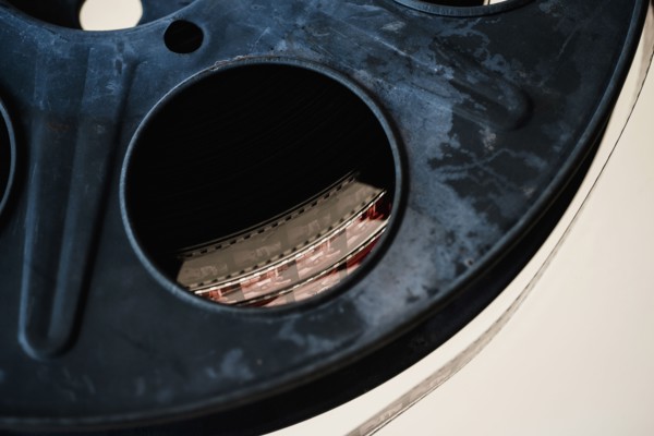 Close-up of film reel on white background.