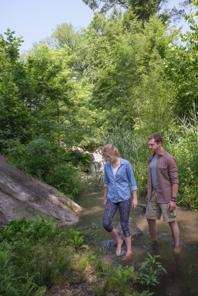 Couple wading in water.