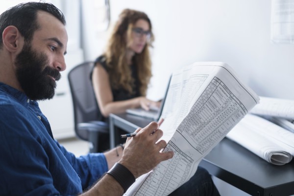 Man and woman working in office.