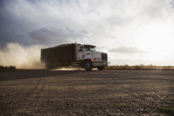 Truck driving in field