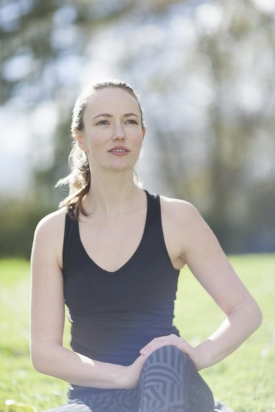 Mid-adult woman exercising in park