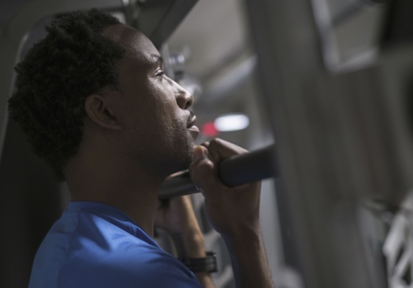 Mid adult man working out in gym.