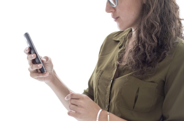 Young woman using smart phone.