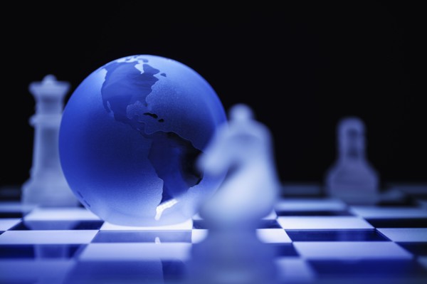 Globe on chess board.
