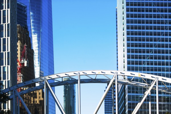 USA, New York State, New York City, Manhattan, Office buildings with bridge in foreground