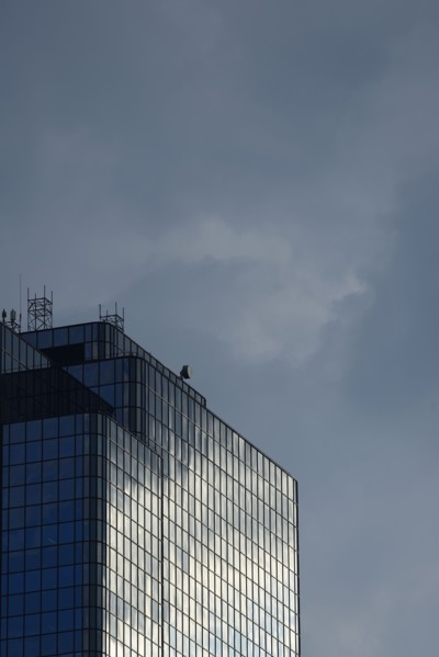 USA, Boston, Massachusetts, Glass office building and cloudy sky