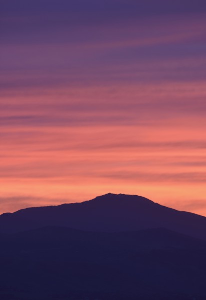 USA, Colorado, Denver, Mountain range with colorful sky at dusk