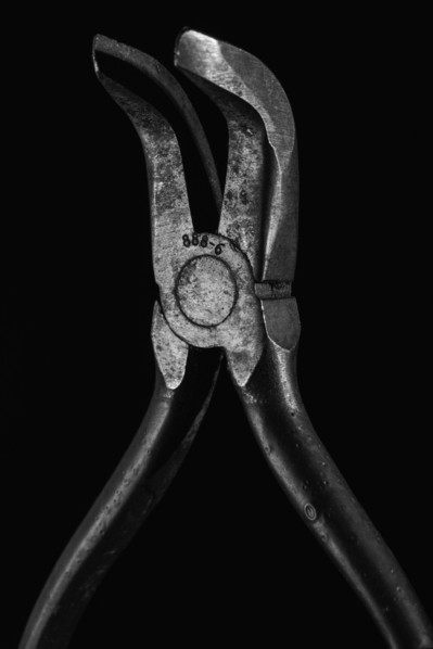 Hand tool against black background